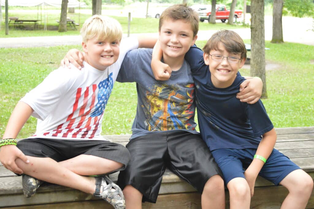 Boys sitting together on a bench
